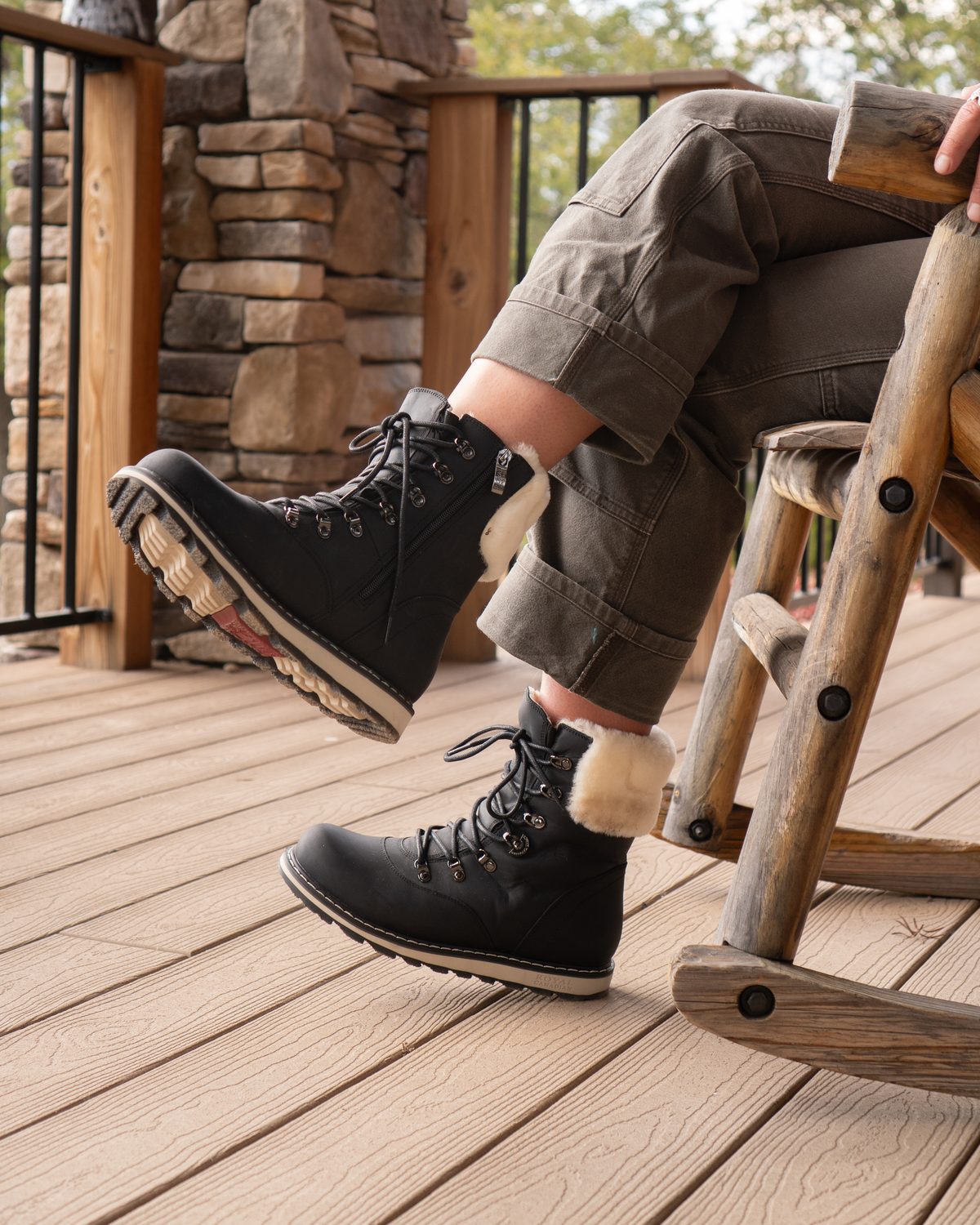 CAMBRIDGE in Black Lager on a porch rocking chair
