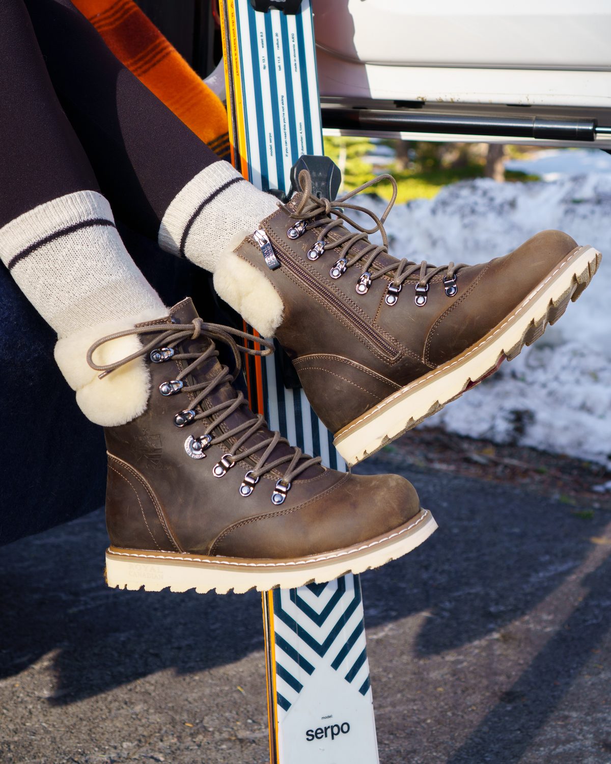 A CAMBRIDGE boot propped on a ski-rack in the snow