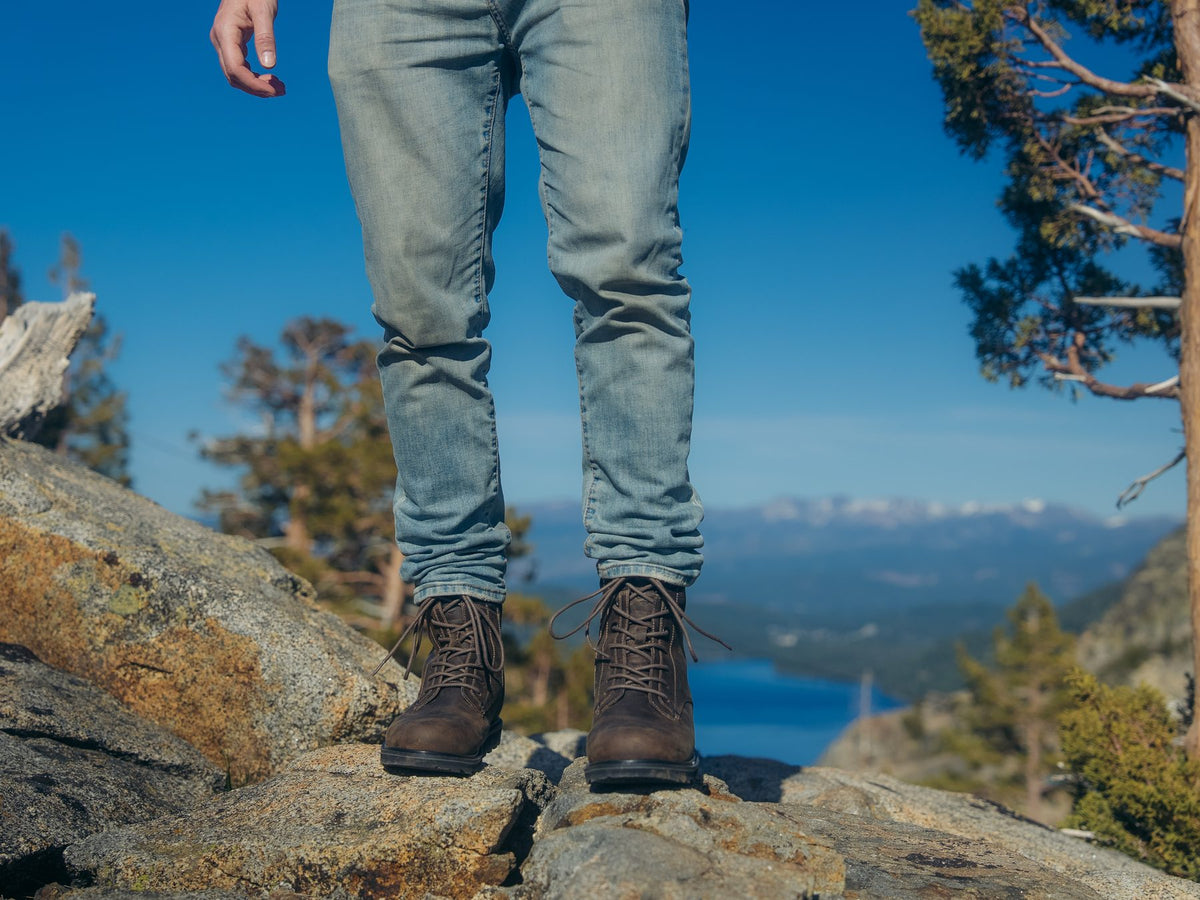 REGENT men's boots on a granite lookout above a lake